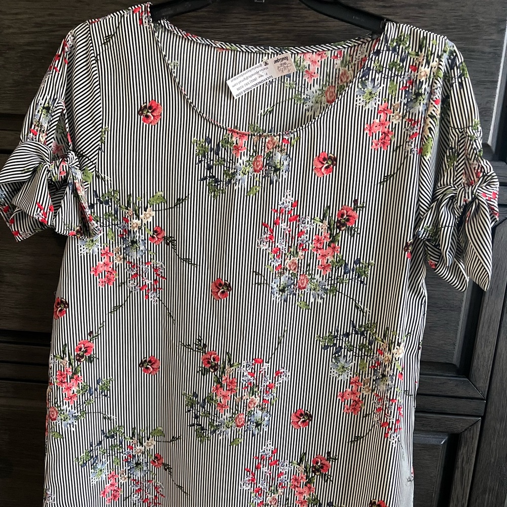 Boutique blouse size M. Black and white stripes with floral print.